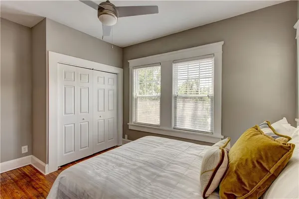 a bedroom with a bed and a window