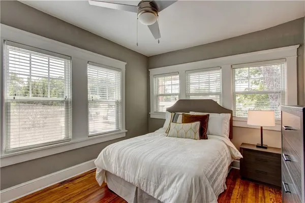 a bedroom with a large bed and a window