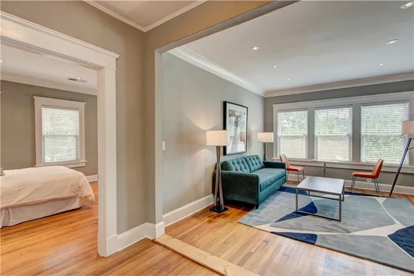 a living room with furniture rug and window