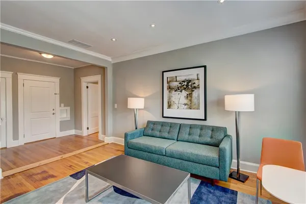 a living room with furniture and a table