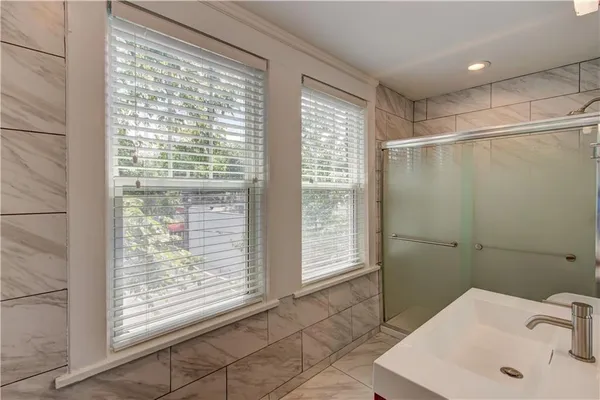 a bathroom with a sink and a shower