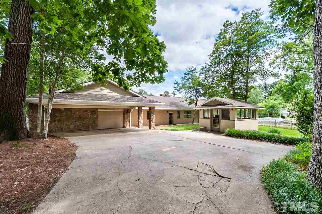 4308 Ryegate Drive Raleigh, NC 27604 - Photo 2 of 23 a front view of a house with a garden
