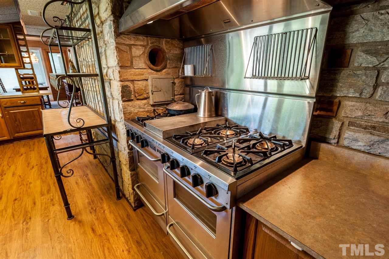 4308 Ryegate Drive Raleigh, NC 27604 - Photo 14 of 23 a kitchen with a stove and a table