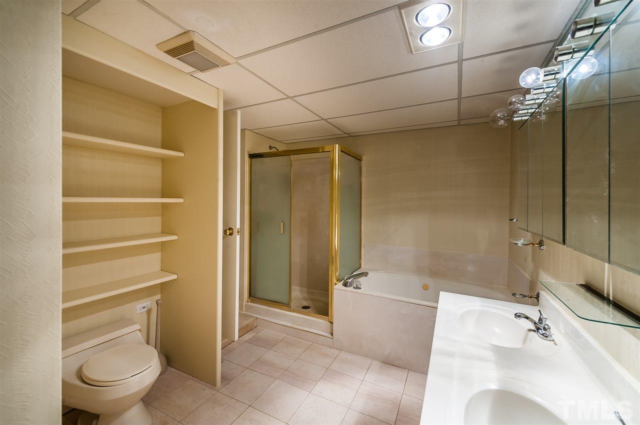 4308 Ryegate Drive Raleigh, NC 27604 - Photo 7 of 23 a bathroom with a sink a toilet and shower