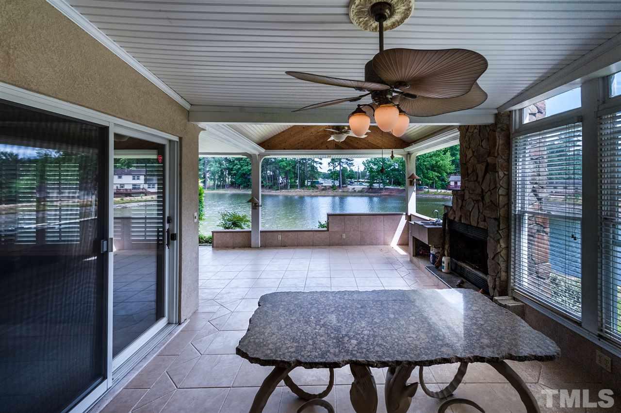 4308 Ryegate Drive Raleigh, NC 27604 - Photo 10 of 23 a view of a patio with a table chairs and a potted plant