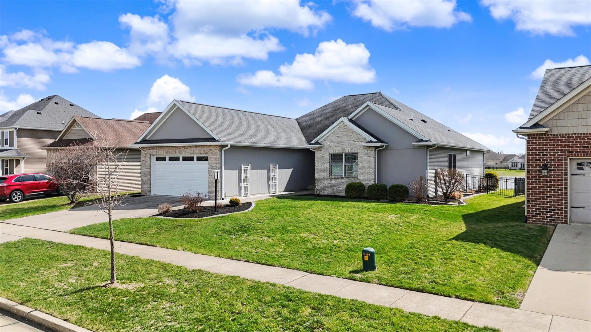 1117 Declaration Drive Savoy, IL 61874 - Photo 2 of 56 a front view of a house with a yard