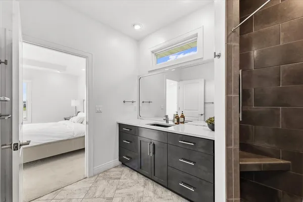 a bathroom with a sink a mirror and a bathtub