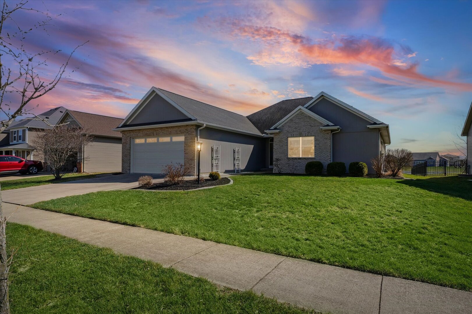 1117 Declaration Drive Savoy, IL 61874 - Photo 4 of 56 a front view of a house with a garden