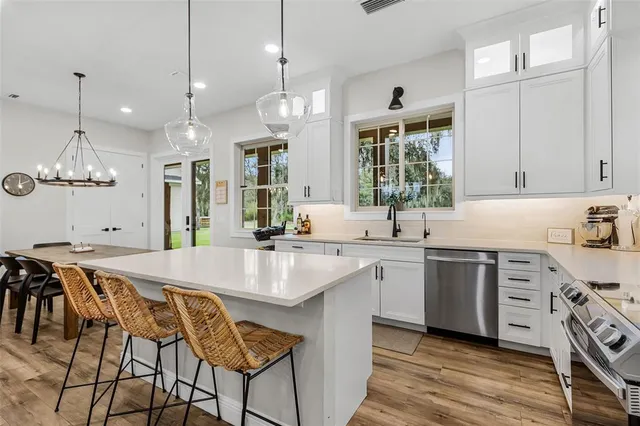 a view of a dining room with furniture and window