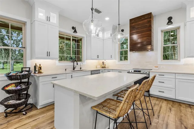 a view of a dining table and a that has a table and chairs