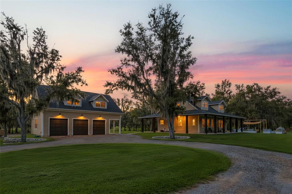 11720 Darsey Road Parrish, FL 34219 - Photo 2 of 60 a front view of a house with a garden