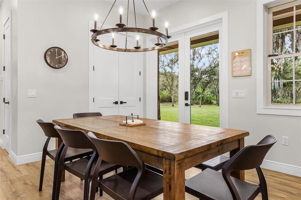 11720 Darsey Road Parrish, FL 34219 - Photo 21 of 60 a view of a dining table and a that has a table and chairs