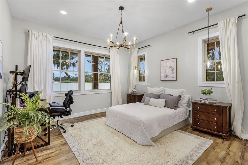 11720 Darsey Road Parrish, FL 34219 - Photo 22 of 60 a bedroom with a bed and wooden floor