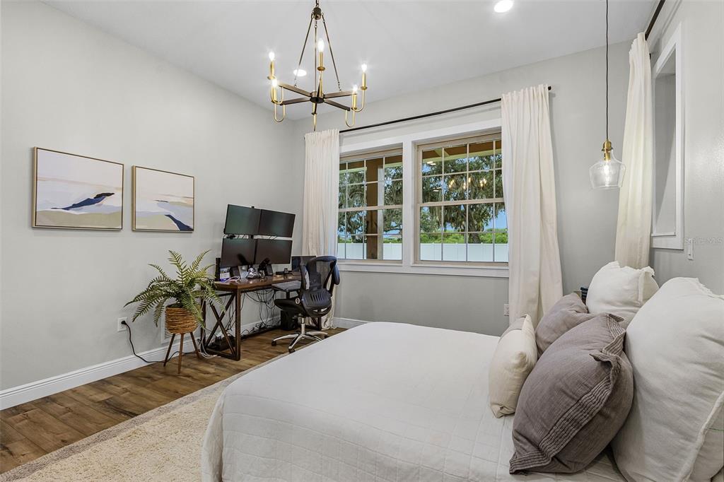 11720 Darsey Road Parrish, FL 34219 - Photo 23 of 60 a bedroom with a bed and a table