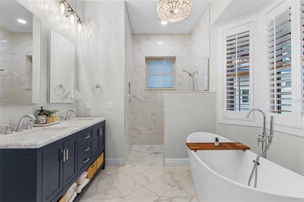 11720 Darsey Road Parrish, FL 34219 - Photo 26 of 60 a bathroom with a tub sink and mirror