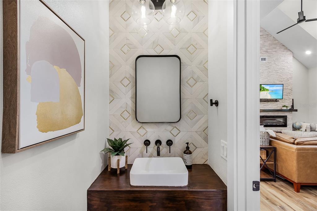 11720 Darsey Road Parrish, FL 34219 - Photo 28 of 60 a bathroom with a sink and a mirror