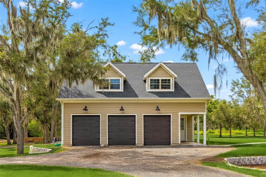 11720 Darsey Road Parrish, FL 34219 - Photo 38 of 60 a front view of a house with a garden