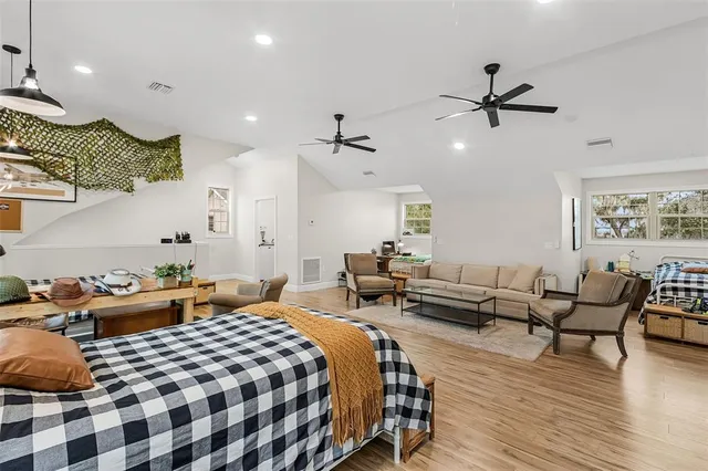 an aerial view of a house with a yard