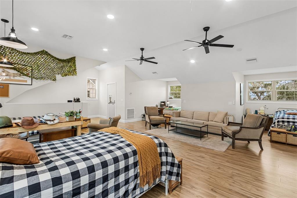 11720 Darsey Road Parrish, FL 34219 - Photo 42 of 60 a bedroom with furniture and wooden floor