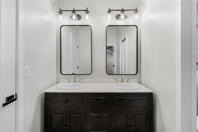 a big yard with lots of trees in the background