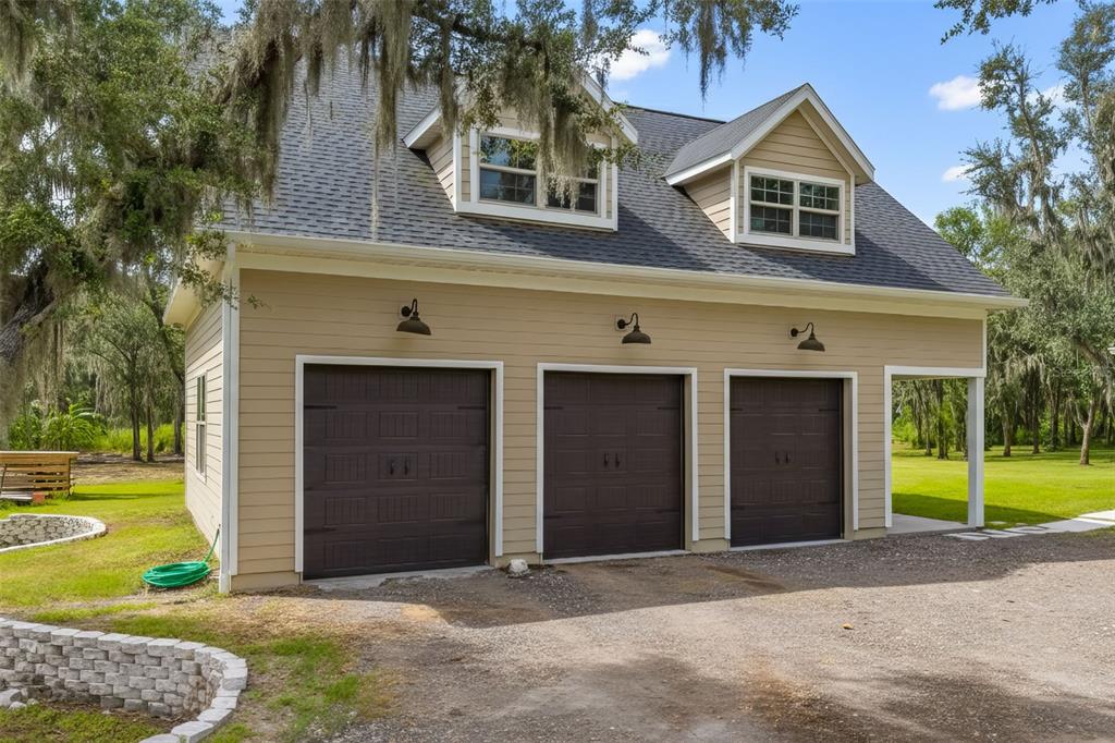 11720 Darsey Road Parrish, FL 34219 - Photo 6 of 60 a front view of a house with a yard and garage