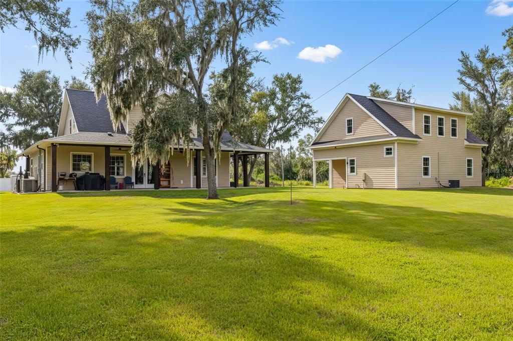11720 Darsey Road Parrish, FL 34219 - Photo 7 of 60 a front view of a house with a garden