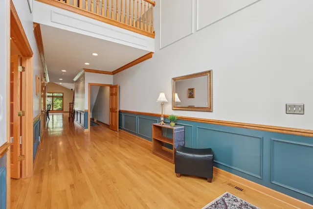 a kitchen with stainless steel appliances kitchen island granite countertop a stove a sink and a wooden cabinets