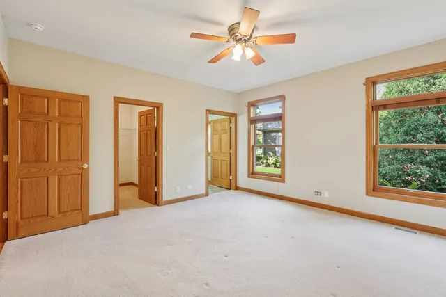 a view of n empty room with window