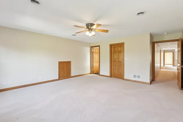 a large bedroom with bed and window
