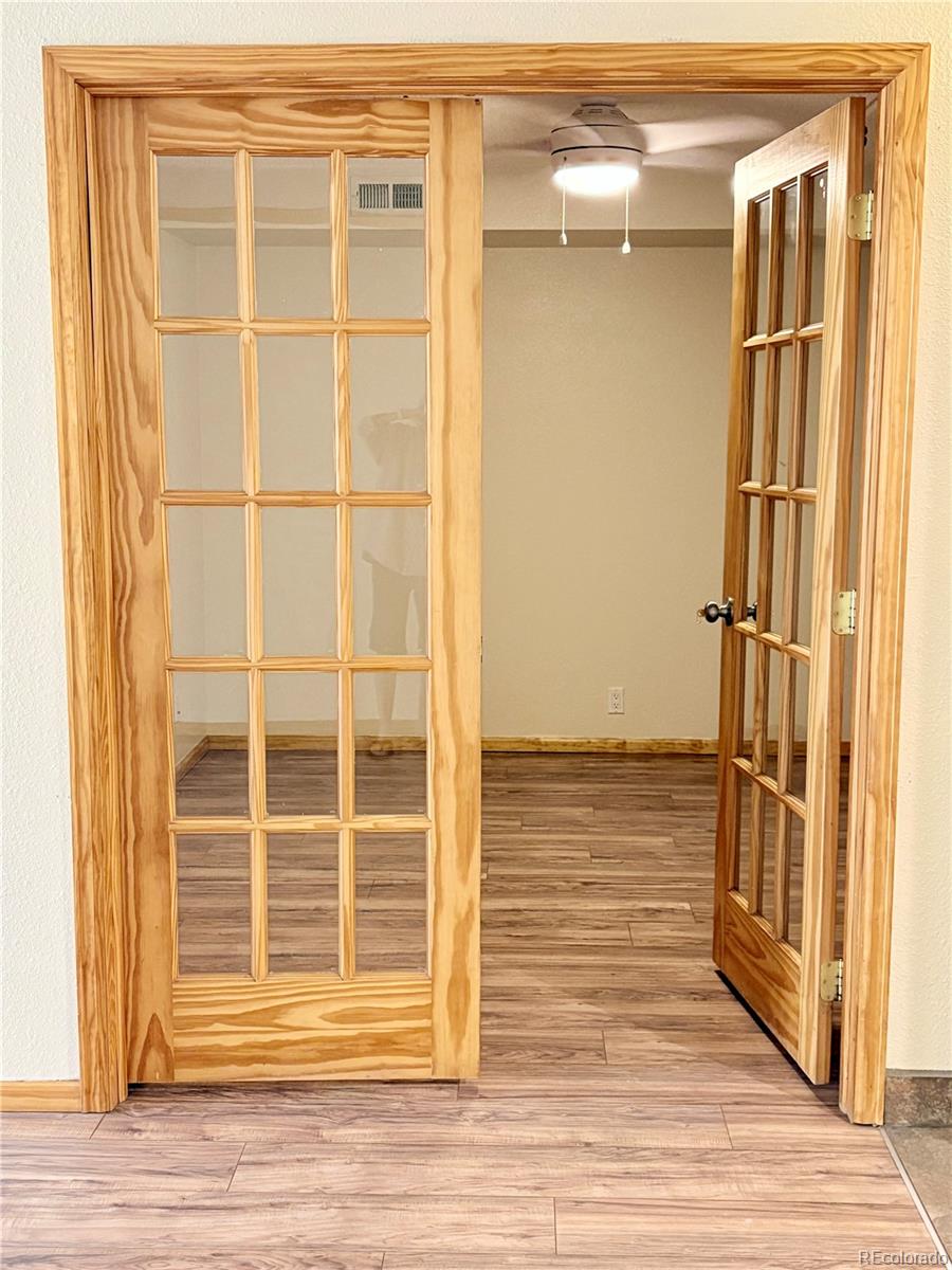 805 29th Street, Unit 253 Boulder, CO 80303 - Photo 11 of 32 a view of a door with wooden floor and a window