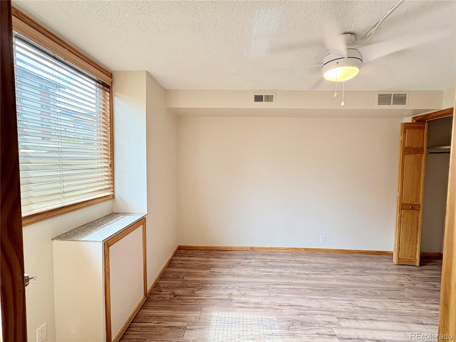 805 29th Street, Unit 253 Boulder, CO 80303 - Photo 15 of 32 a view of a room with wooden floor and staircase