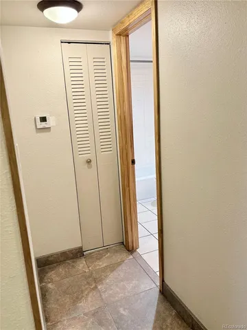 a view of a closet area with empty room