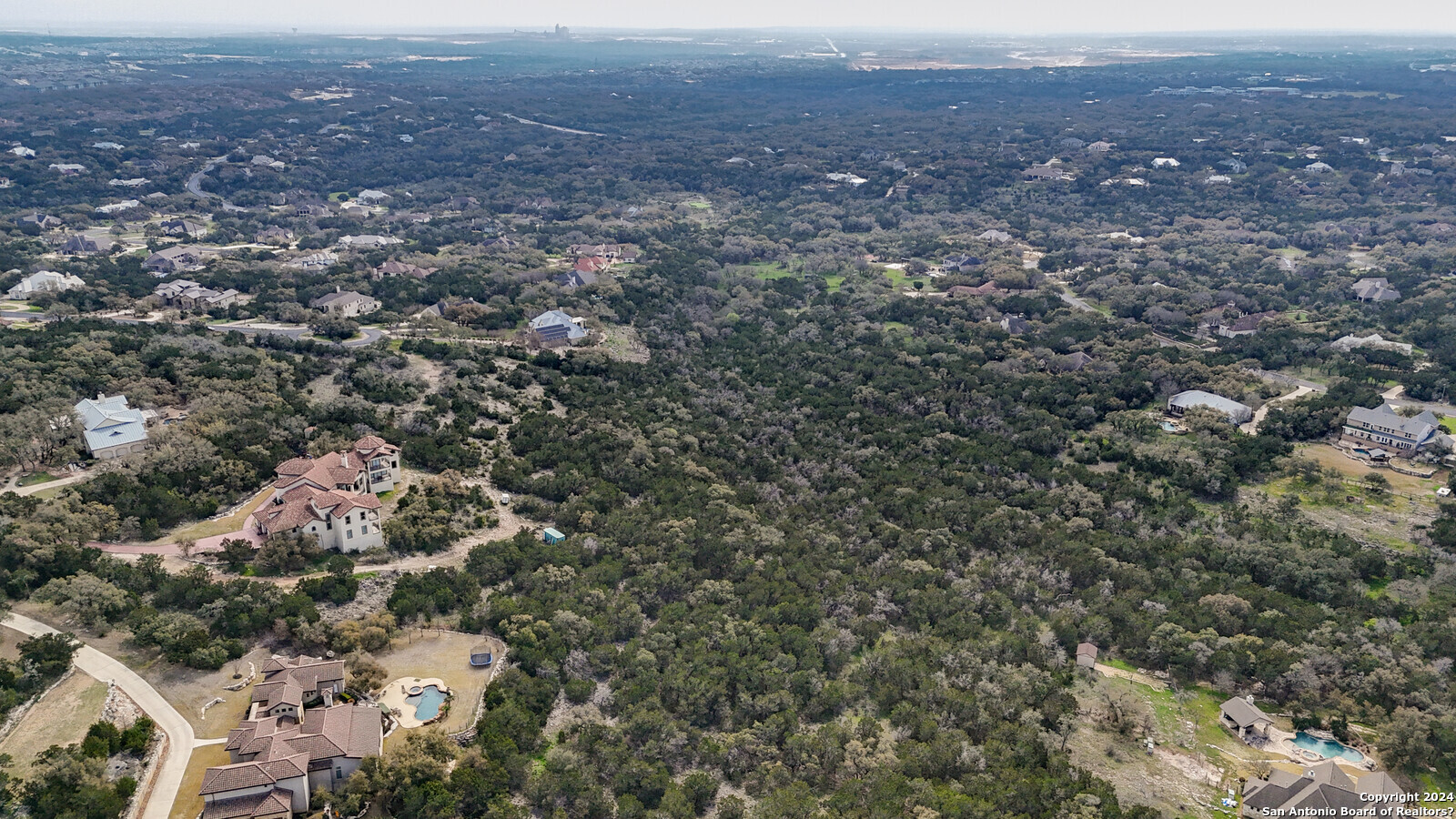 3907 Wilderness Rim San Antonio, TX 78261 - Photo 14 of 17 an aerial view of house with yard and mountain view in back