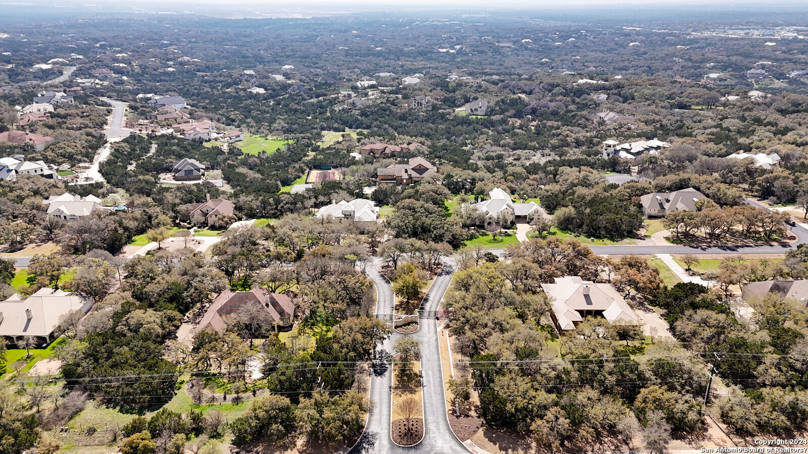 3907 Wilderness Rim San Antonio, TX 78261 - Photo 3 of 17 an aerial view of residential houses with city and green space