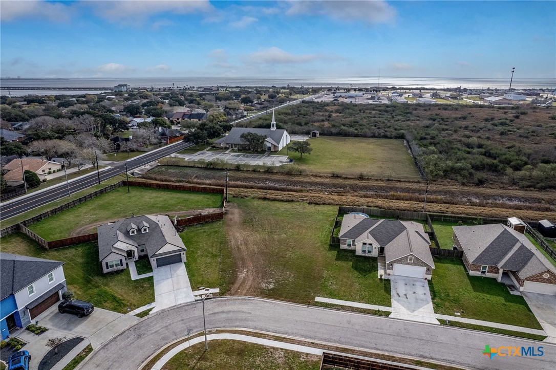 101 Opal Way Port Lavaca, TX 77979 - Photo 5 of 8 an aerial view of a house with a garden and lake view