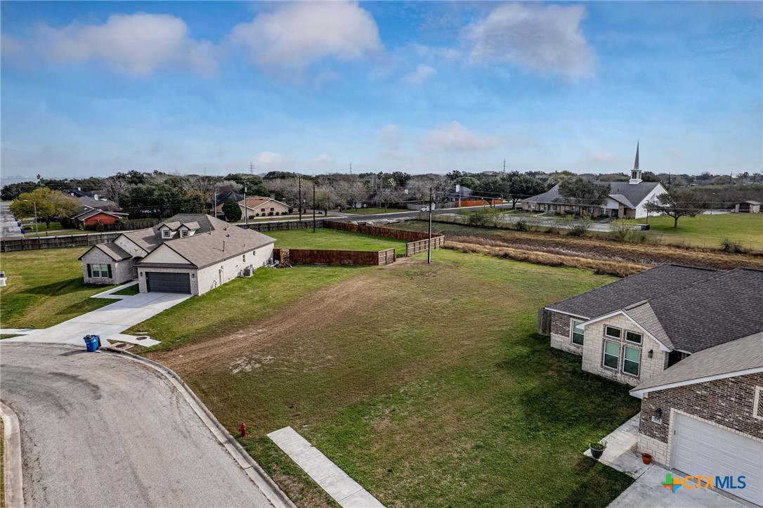 101 Opal Way Port Lavaca, TX 77979 - Photo 6 of 8 a view of a lake with lawn chairs