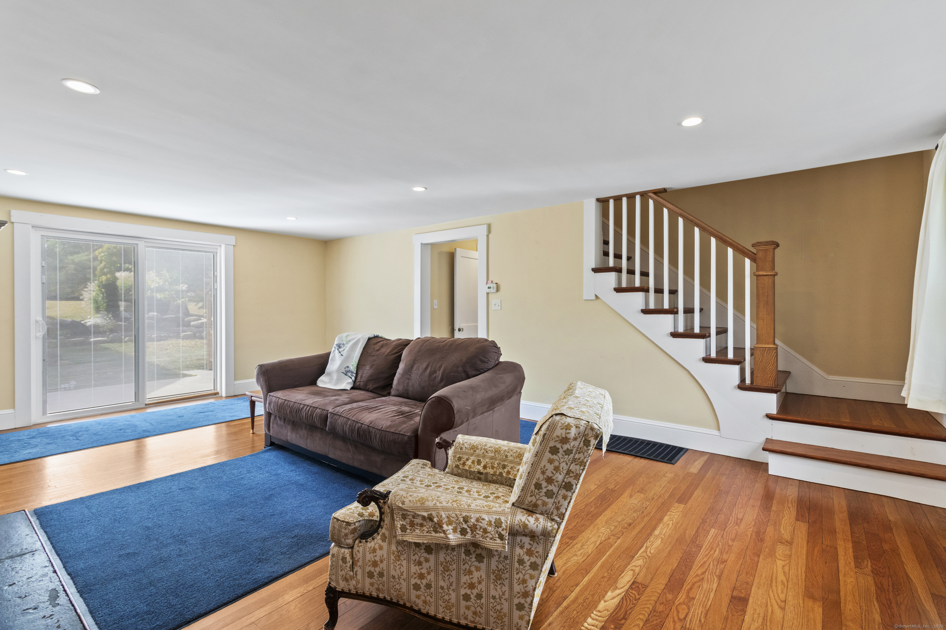 587 Taugwonk Road Stonington, CT 06378 - Photo 23 of 38 a living room with furniture and a floor to ceiling window