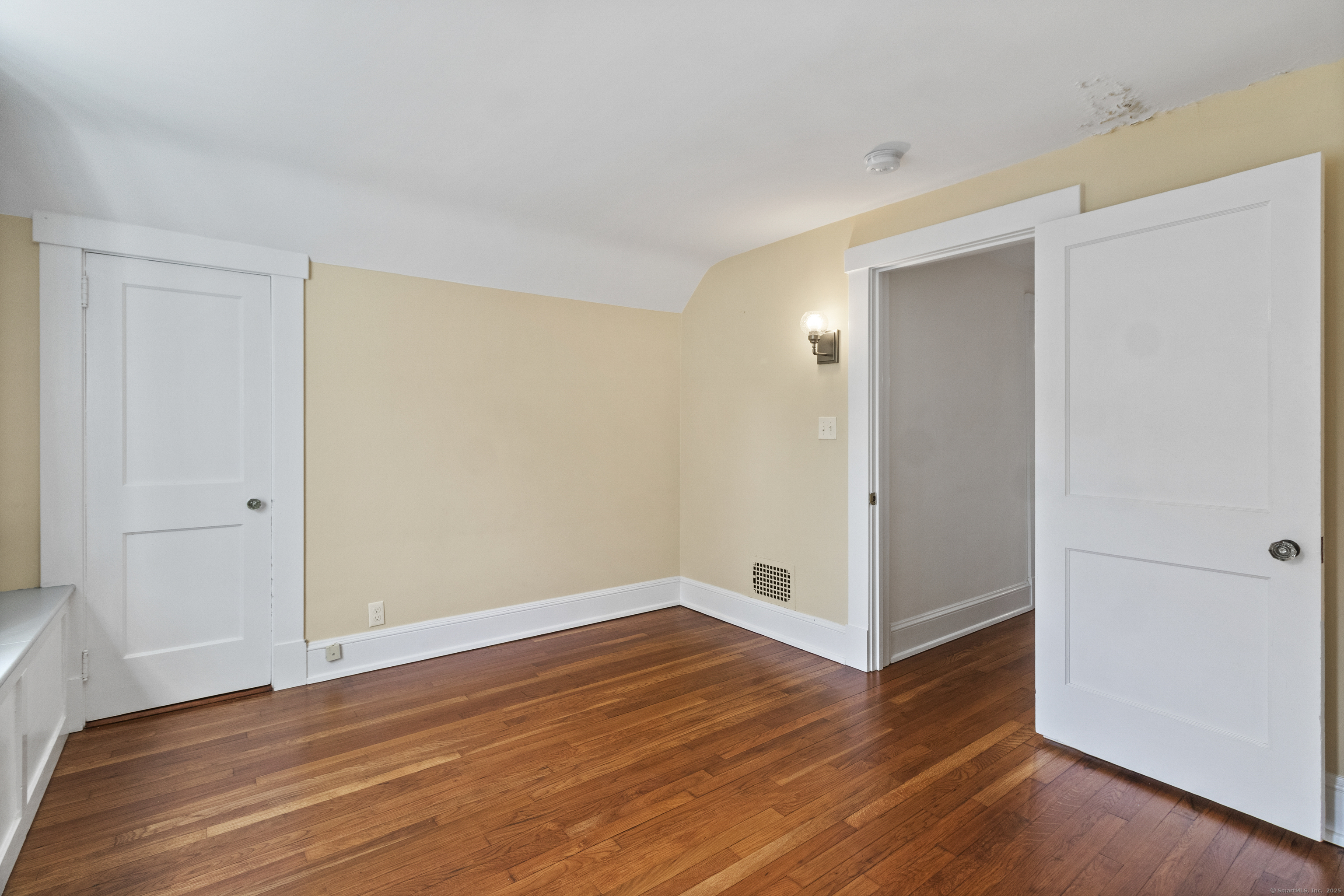 587 Taugwonk Road Stonington, CT 06378 - Photo 27 of 38 a view of empty room with wooden floor
