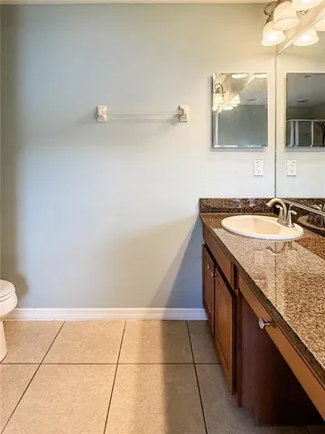 an empty room with wooden floor and closet