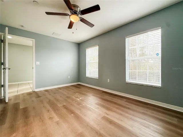a bathroom with a sink a mirror and shower