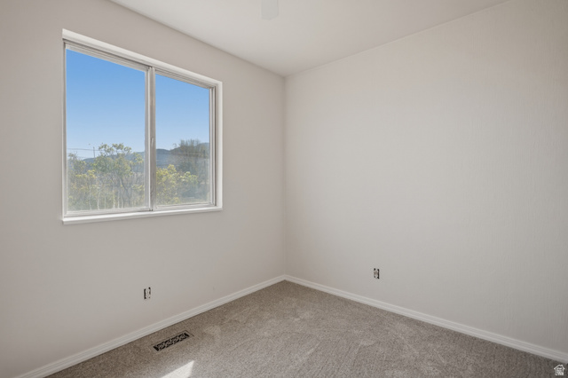 337 North Main Street Central Valley, UT 84754 - Photo 19 of 40 Spare room featuring light carpet and ceiling fan