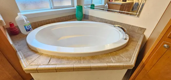 a bathroom with a sink and mirror