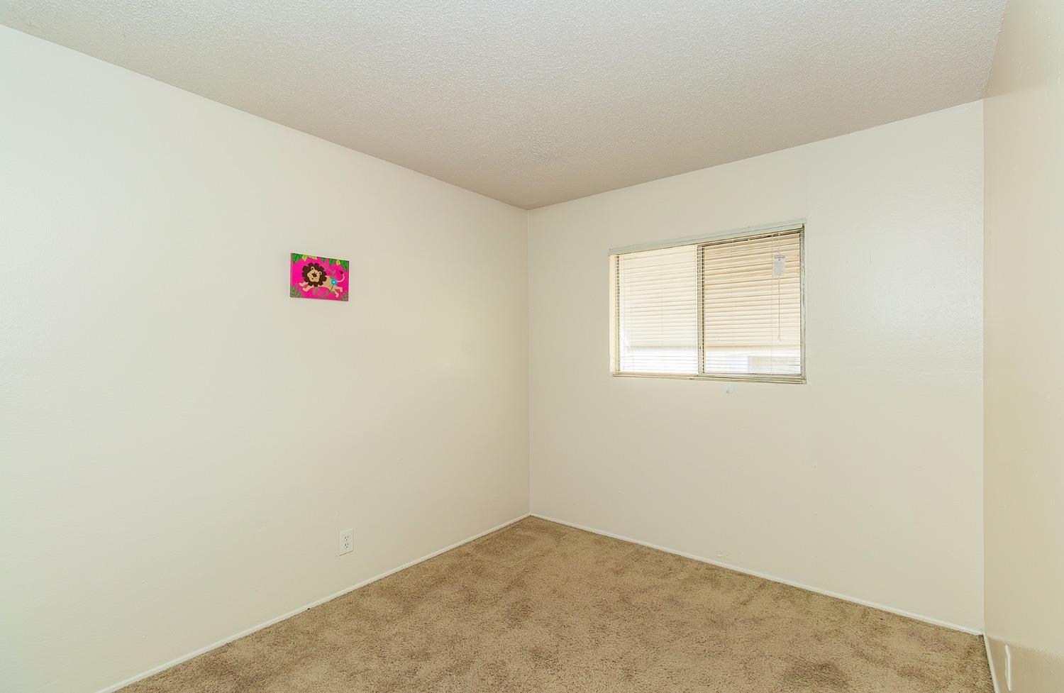902 Music Avenue Clovis, CA 93612 - Photo 12 of 21 an empty room with a hallway