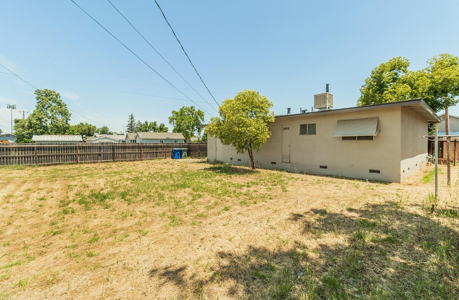 902 Music Avenue Clovis, CA 93612 - Photo 16 of 21 a view of a house with a swimming pool