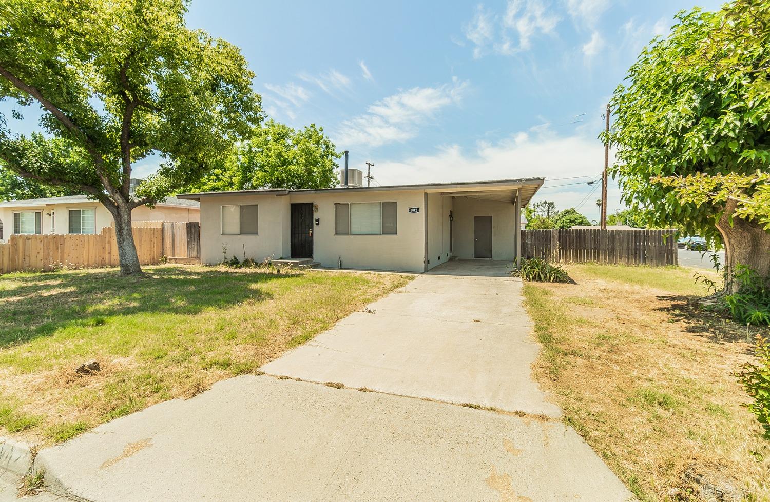 902 Music Avenue Clovis, CA 93612 - Photo 18 of 21 a swimming pool with trees in front of it