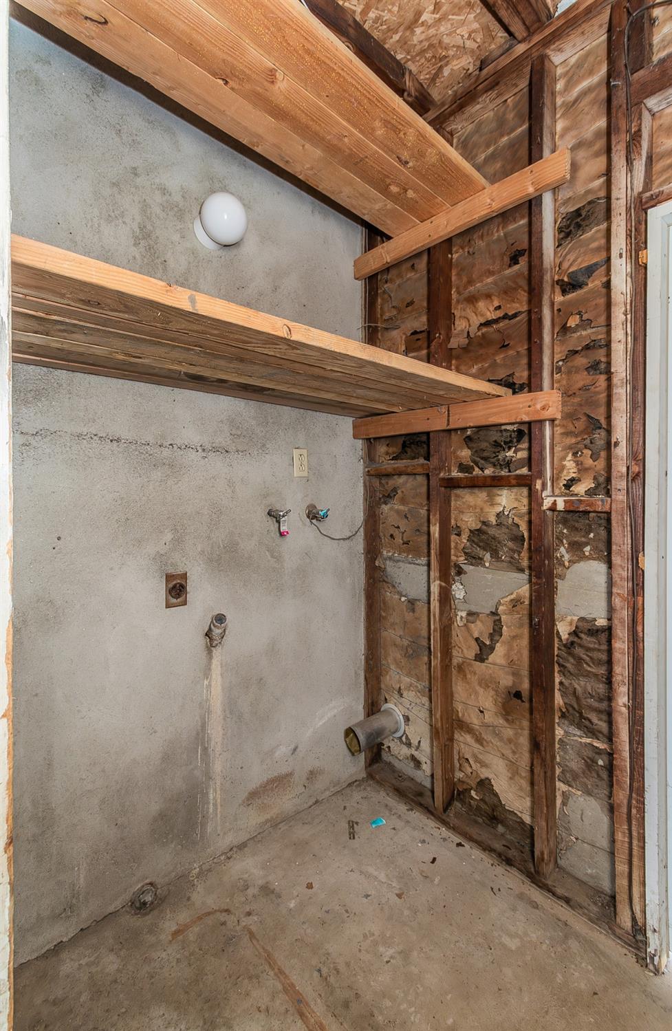 902 Music Avenue Clovis, CA 93612 - Photo 19 of 21 a view of a room with water heater and racks