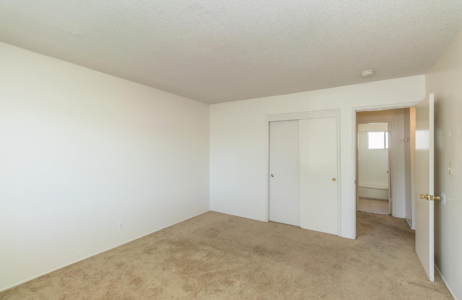 902 Music Avenue Clovis, CA 93612 - Photo 9 of 21 a view of an empty room and closet area