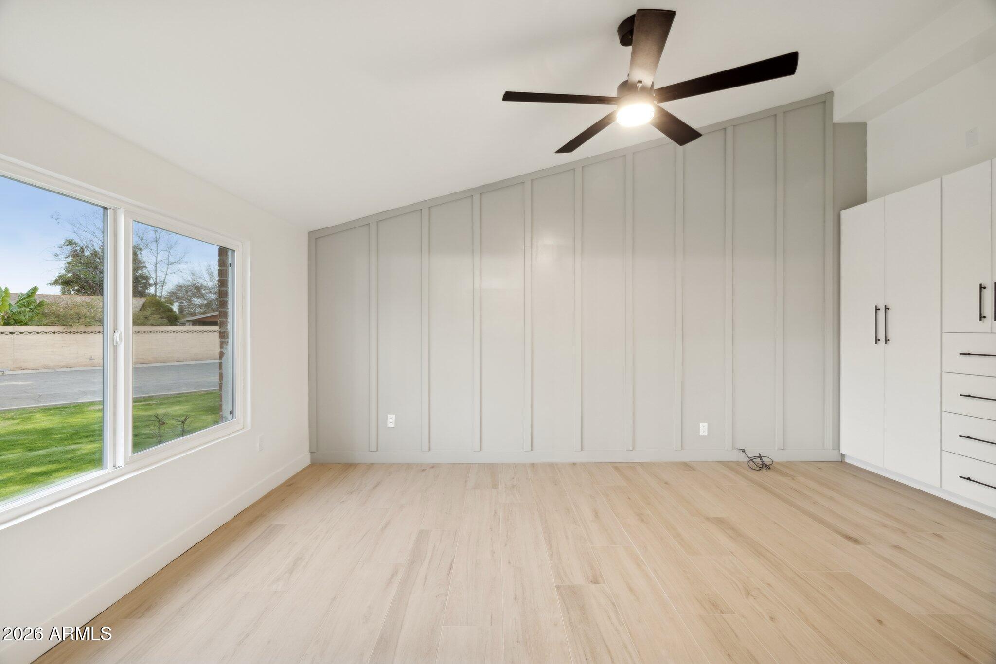 1216 West Rovey Avenue Phoenix, AZ 85013 - Photo 17 of 45 a view of room with a ceiling fan and window