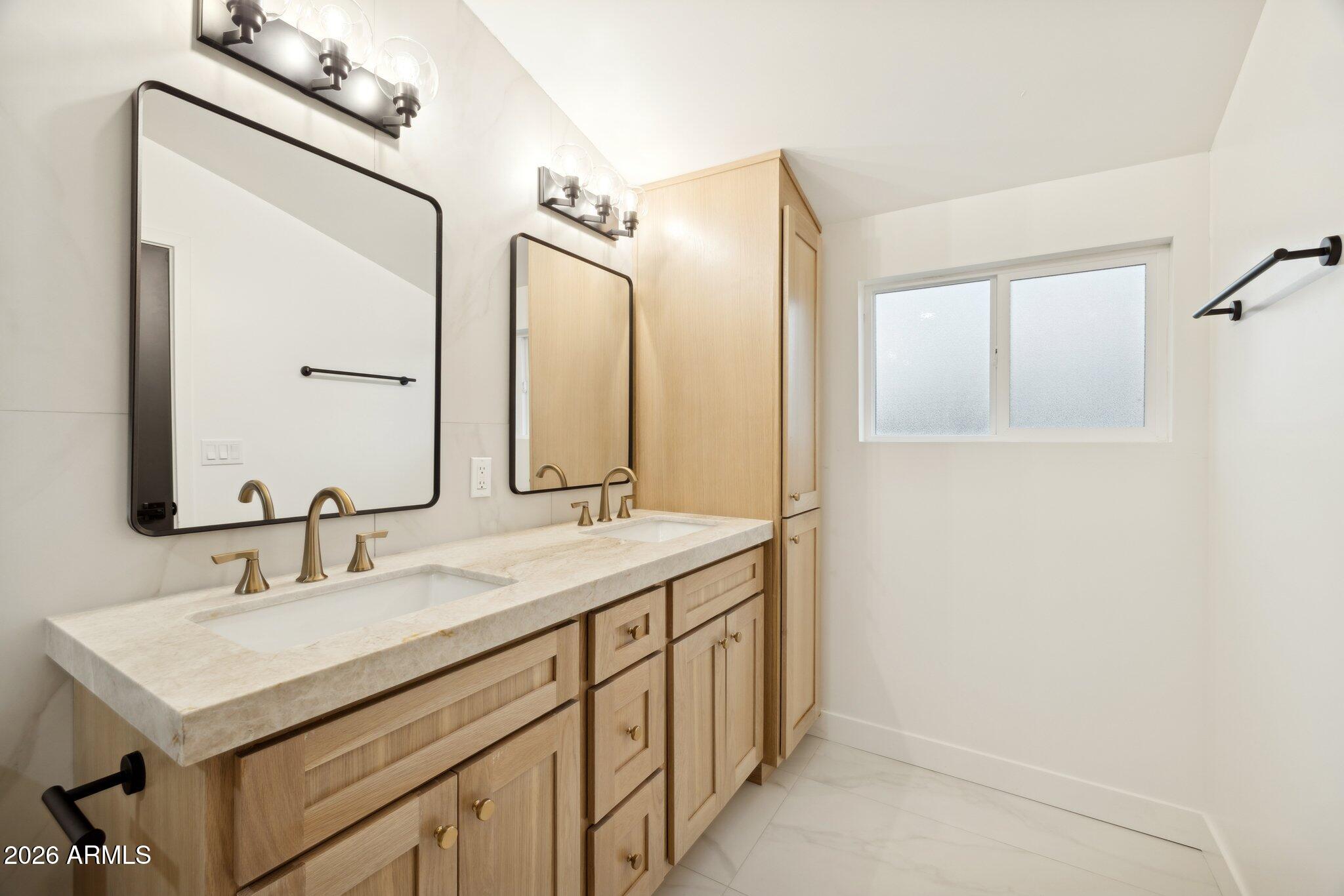 1216 West Rovey Avenue Phoenix, AZ 85013 - Photo 21 of 45 a bathroom with a sink and a mirror