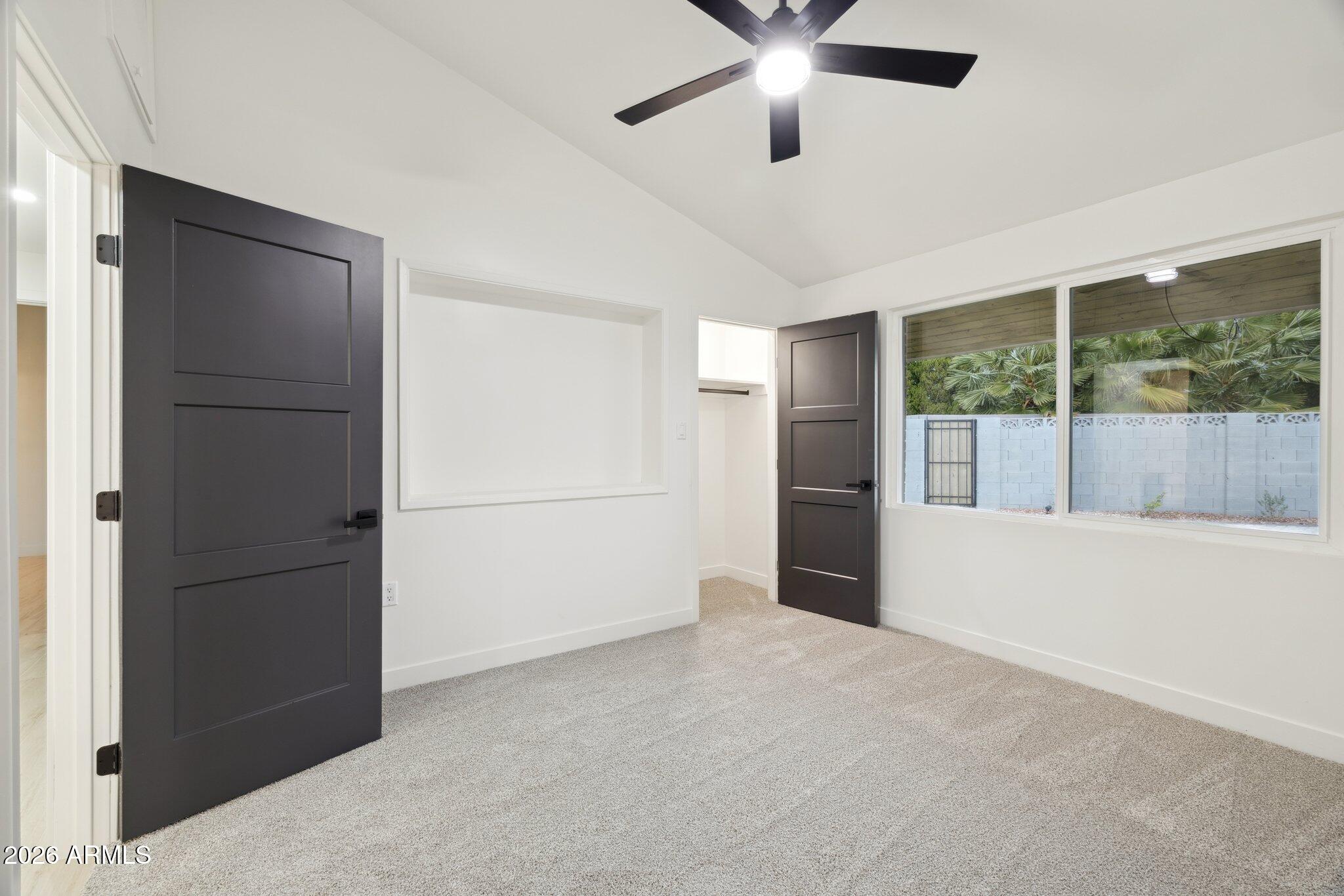 1216 West Rovey Avenue Phoenix, AZ 85013 - Photo 23 of 45 a view of a livingroom with a ceiling fan and window